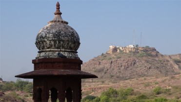 A dome with Tekri Mata mandir in the background